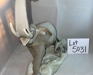 Lot 5031.   $175.00   Lladro Porcelain #1151  "Two Elephants" Mother and Calf. Figurine.  10" W base, 12" H  Mom and  2" H for Calf. Really a cool piece.  Sold on eBay for up to $275.00 