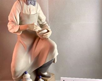 Lot 5032. $275.00  Retired  Lladro Porcelain Figurine, "The Pharmacist" #4844 in Matte Finish. Also includes: Cloche case and wood base.  12.5" H x 6.5" W x 5.25 D