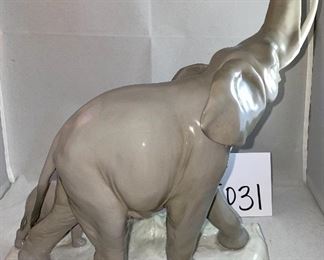 Lot 5031.   $175.00   Lladro Porcelain #1151  "Two Elephants" Mother and Calf. Figurine.  10" W base, 12" H  Mom and  2" H for Calf. Really a cool piece.  Sold on eBay for up to $275.00 