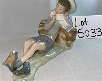 Lot 5033. $75.00  Lladro Porcelain Figurine #4730, "Shepherd Boy" resting on a log  with a bird on his shoe, Glossy finish. 8" L x 5.25" H  x  5" D.  Excellent condition.