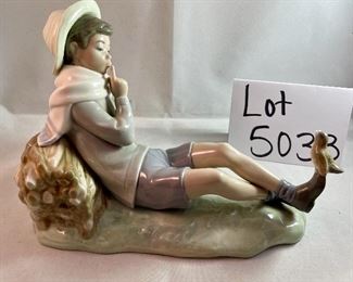 Lot 5033. $75.00  Lladro Porcelain Figurine #4730, "Shepherd Boy" resting on Log  with bird on shoe, Glossy finish. 8" L x 5.25" H  x  5" D.