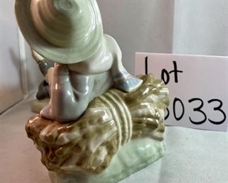 Lot 5033.  $75.00  Lladro Porcelain Figurine #4730, "Shepherd Boy" resting on Log  with bird on shoe, Glossy finish. 8" L x 5.25" H  x  5" D.