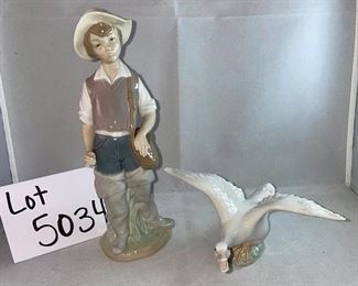 Lot 5034. $48.00  2 pc Lladro lot.  Lladro Gone Fishing, Boy with waders (missing a finger and a fishing pole #4809) and Lladro Goose "Taking Flight" excellent shape. No boxes. Sold as shown.