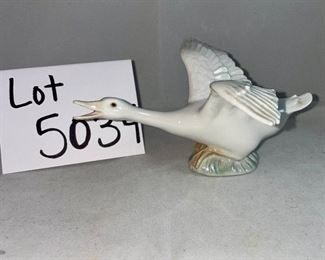 Lot 5034. $48.00 2 pc Lladro lot.  Lladro Gone Fishing, Boy with waders (missing a finger and a fishing pole #4809) and Lladro Goose "Taking Flight" excellent shape. No boxes. Sold as shown.