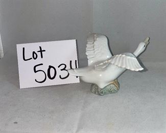 Lot 5034. $48.00 2 pc Lladro lot.  Lladro Gone Fishing, Boy with waders (missing a finger and a fishing pole #4809) and Lladro Goose "Taking Flight" excellent shape. No boxes. Sold as shown.