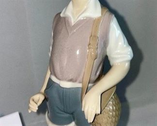Lot 5034. $48.00 2 pc Lladro lot.  Lladro Gone Fishing, Boy with waders (missing a finger and a fishing pole #4809) and Lladro Goose "Taking Flight" excellent shape. No boxes. Sold as shown.
