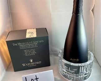 Lot 5037.  $28.00. NIB. Waterford Crystal Bottle Coaster, Millennium Collection.  5.25" h x 3"t
Retails for $115  w/box. Another nice gift! (Bottle of Wine not included)