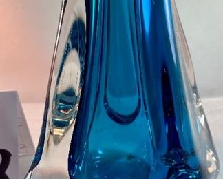 Lot 5078. $110.00   Another Beautiful Paul Harrie Art Glass Vase. "Athena" in Azure/Teal. Small  6" H x  3" opening x 7" W.  Paul Harrie had his own studio in Southern California since 1980 and he passed in 2016.  His work is acclaimed worldwide,  We have 1 of these available,   