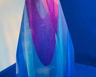 Lot 5082.  $275.00   2 Gorgeous Pieces of Harrie Glass, the first is a  STUNNING Flame in blues, purple, and clear 9.5" H  x 3" W.  The second piece is a blue and clear Ellipse on base 6" W x 3.25" D. I was able to find these same flame online fetching $400 and an ellipse without the base for $165. So our price is a STEAL for both pieces.