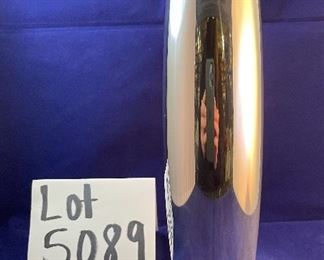 Lot 5089 $35.00 Nambe' Spiral Vase 9.75" H, (1998) Designer: Smith Celentano (#6191).  Recognized for its award-winning designs for more than 60 years, Nambé’s commitment to timeless beauty, artistic integrity and uncompromising quality is evident in the brand’s collection of serveware, barware, home décor and gift items. 