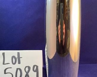 Lot 5089 $35.00 Nambe' Spiral Vase 9.75" H, (1998) Designer: Smith Celentano (#6191).  Recognized for its award-winning designs for more than 60 years, Nambé’s commitment to timeless beauty, artistic integrity and uncompromising quality is evident in the brand’s collection of serveware, barware, home décor and gift items. 