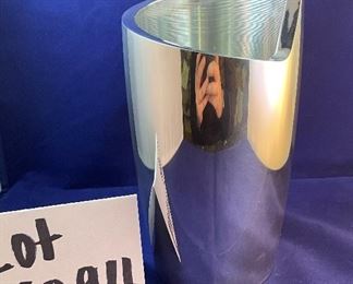 Lot 5094.   $65.00. Nambe Spiral Wine Chiller 8.5" t, Designer Smith Celentano. "The Spiral Wine Chiller" offers the perfect cradling shape for a bottle of your favorite vintage. The simple, yet bold, artistic statement of the design resembles the winding turn of a spiral staircase, sure to stand out in your décor. Chill it in the freezer beforehand to keep your whites and dessert wines cool" Box states Sug. Retail $135. Current Retail on Nambe site $150.00, includes box. We have 12 wine chillers.