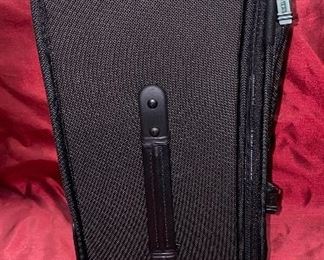 Lot 5099. Asking $325.00. Tumi Black New Ballistic Nylon Wheel-a-Way Vertical Office. Style 2205 New With Tags and original and Box  MSRP: $595.00	13.5" x 20" x 8"