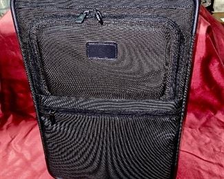 Lot 5099. Asking $325.00. Tumi Black New Ballistic Nylon Wheel-a-Way Vertical Office. Style 2205 New With Tags and original and Box  MSRP: $595.00	13.5" x 20" x 8"
