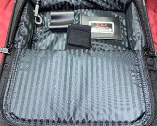 Lot 5099. Asking $325.00. Tumi Black New Ballistic Nylon Wheel-a-Way Vertical Office. Style 2205 New With Tags and original and Box  MSRP: $595.00	13.5" x 20" x 8"