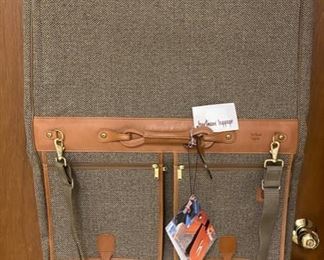 Lot 5102. Asking $100.00.   Brand New in Box Hartmann American Classics Tweed Collection. 44"  4-Suiter. New with Tags and original box, Photo of open Garment Bag.