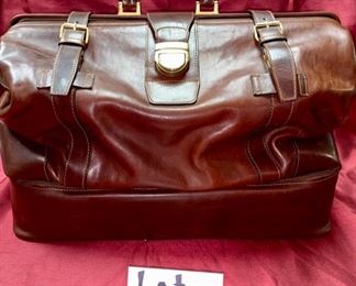 Lot 5101. Asking $250.00. Alessandro Venanzi Made in Italy Brown Leather Exterior with tan leather interior Travel Satchel.   #9970.  Zipper bottom compartment	19"w x 12"d x 12"t.  Clearly the nicest piece of luggage we will ever have the opportunity to sell.  Vintage, Fabulous.  I told Steve this looks like something James Bond would carry!  Original Price over $1200.00