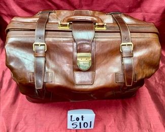 Lot 5101. Asking $250.00. Alessandro Venanzi Made in Italy Brown Leather Exterior with tan leather interior Travel Satchel.   #9970.  Zipper bottom compartment	19"w x 12"d x 12"t.  Clearly the nicest piece of luggage we will ever have the opportunity to sell.  Vintage, Fabulous.  I told Steve this looks like something James Bond would carry!  Original Price over $1200.00