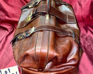 Lot 5101. Asking $250.00. Alessandro Venanzi Made in Italy Brown Leather Exterior with tan leather interior Travel Satchel.   #9970.  Zipper bottom compartment	19"w x 12"d x 12"t.  Clearly the nicest piece of luggage we will ever have the opportunity to sell.  Vintage, Fabulous.  I told Steve this looks like something James Bond would carry!  Original Price over $1200.00