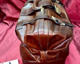 Lot 5101. Asking $250.00. Alessandro Venanzi Made in Italy Brown Leather Exterior with tan leather interior Travel Satchel.   #9970.  Zipper bottom compartment	19"w x 12"d x 12"t.  Clearly the nicest piece of luggage we will ever have the opportunity to sell.  Vintage, Fabulous.  I told Steve this looks like something James Bond would carry!  Original Price over $1200.00
