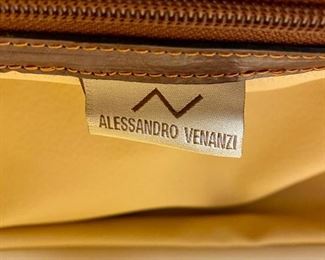 Lot 5101. Asking $250.00. Alessandro Venanzi Made in Italy Brown Leather Exterior with tan leather interior Travel Satchel.   #9970.  Zipper bottom compartment	19"w x 12"d x 12"t.  Clearly the nicest piece of luggage we will ever have the opportunity to sell.  Vintage, Fabulous.  I told Steve this looks like something James Bond would carry!  Original Price over $1200.00