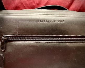 Lot 5108. $250.00  Porsche Design Black Leather Saddlebag Style Carry On 2 compartments, Zipper Pocket, Excellent Condition!  20" W x 15" H,  4"D.  Similar Porsche Design Leather Bags sell for $500-750.