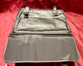 Lot 5108. $250.00  Porsche Design Black Leather Saddlebag Style Carry On 2 compartments, Zipper Pocket, Excellent Condition!  20" W x 15" H,  4"D.  Similar Porsche Design Leather Bags sell for $500-750.