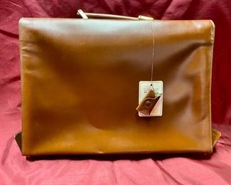 Lot 5113. $125.00  Like New Vera Pelle Leather Briefcase and Lock Anticato Tobacco Color. 4 compartments 1 zipper pocket. Made in Italy. 15.5" W x 12" H x 2.5" D