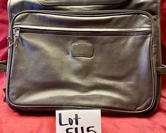 Lot 5115.  $85.00. Brown Leather "The Shoe Horn" Saddle Bag. Used to go over a Suitcase for additional storage. 2 zipper pockets and 1 zipper compartment. 16" W  x 12" H.  In addition we have included a  solid brass shoe horn. 16" W  x 12" H