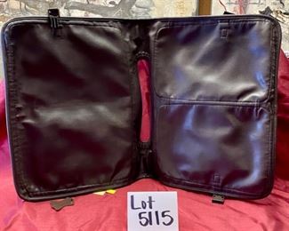 Lot 5115.  $85.00. Brown Leather "The Shoe Horn" Saddle Bag. Used to go over a Suitcase for additional storage. 2 zipper pockets and 1 zipper compartment. 16" W  x 12" H.  In addition we have included a  solid brass shoe horn. 16" W  x 12" H