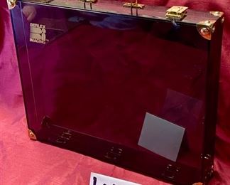 Lot 5116. $75.00 Cool dapy- made in France. Black Clear Acrylic Briefcase, Labeled: Berlex Imaging tm.  This is an advertising-marketing product.  Slight chip on top by latch (see photos)	17" W x 13.5" H  x 3" D.  Dapy is a Manufacturer of Luxury Packaging using acrylics. 
