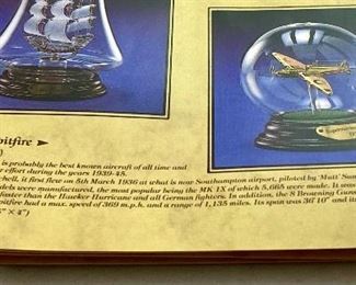 Lot 5120. $70.00  Vintage Airplane (Biplane) WWI Print Nieuport Ni. 17Print (19" W x 15" H) and Rare Mayflower Supermarine Spitfire 1939 in Glass Globe and wood base (w/original box).  Late addition:  Beautiful coffee table book entitled "Aviation".  Great 