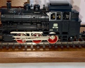 Lot 5124. $45.00  Pristine Vintage Marklin Locomotive HO BR 89 3000 (Made in Germany, #10057831) with display track on wood base. Locomotive doesn't have a box, but does have a plastic protective layer, parts list. 
