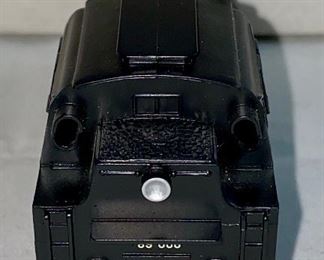 Lot 5124. $45.00  Pristine Vintage Marklin Locomotive HO BR 89 3000 (Made in Germany, #10057831) with display track on wood base. Locomotive doesn't have a box, but does have a plastic protective layer, parts list. 