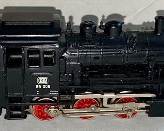Lot 5124. $45.00  Pristine Vintage Marklin Locomotive HO BR 89 3000 (Made in Germany, #10057831) with display track on wood base. Locomotive doesn't have a box, but does have a plastic protective layer, parts list. 