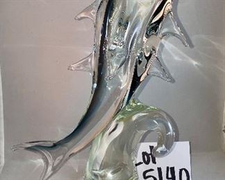 Lot 5140. $60.00 Murano Glass Dolphin by Formia Vetri Di Murano. Beautiful, clear and blue. Sold as is, has a chip in one of the fins, but it was too cool to not include. 16" H  x 10" D x 5"W   Has sold for $195 online, so our slightly injured dolphin is well-priced, as he is GORGEOUS.