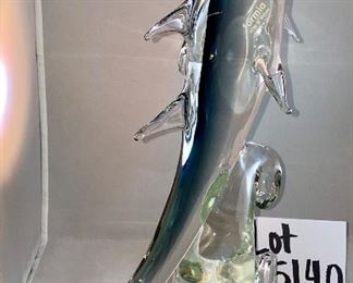 Lot 5140. $60.00 Murano Glass Dolphin by Formia Vetri Di Murano. Beautiful, clear and blue. Sold as is, has a chip in one of the fins, but it was too cool to not include. 16" H  x 10" D x 5"W   Has sold for $195 online, so our slightly injured dolphin is well-priced, as he is GORGEOUS.