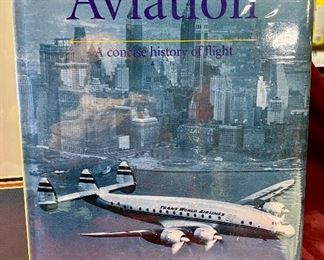  Lot 5120. $70.00  Vintage Airplane (Biplane) WWI Print Nieuport Ni. 17Print (19" W x 15" H) and Rare Mayflower Supermarine Spitfire 1939 in Glass Globe and wood base (w/original box).  Late addition:  Beautiful coffee table book entitled "Aviation".  Great 