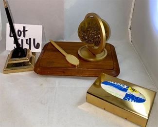Lot 5146. $48.00  Desk Accessories; Gold Tone letter opener, gold tone Kleenex holder,  Chicago spinning medallion on a wood base, and a Cross ballpoint pen with brass stand. 