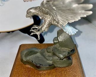 Lot 5148. $30.00  Eagle Package. Pewter Bald Eagle on Wood Base (5.5"h x 4" sq base), Limited Edition 11" bald eagle plate by W.D. Galther 1995 (in relief).  The Pewter Eagle sells for $39.99 alone...