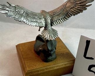 Lot 5148. $30.00  Eagle Package. Pewter Bald Eagle on Wood Base (5.5"h x 4" sq base), Limited Edition 11" bald eagle plate by W.D. Galther 1995 (in relief).  The Pewter Eagle sells for $39.99 alone...