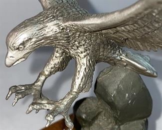 Lot 5148. $30.00  Eagle Package. Pewter Bald Eagle on Wood Base (5.5"h x 4" sq base), Limited Edition 11" bald eagle plate by W.D. Galther 1995 (in relief).  The Pewter Eagle sells for $39.99 alone...