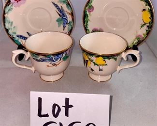Lot 5152. $27.00  Lenox Birds of America Tea Cup and Saucers 1 Goldfinch and 1 Blue Jay (both issued 1993) and a Profiles Parrot Art Glass Plate 13" Diameter.