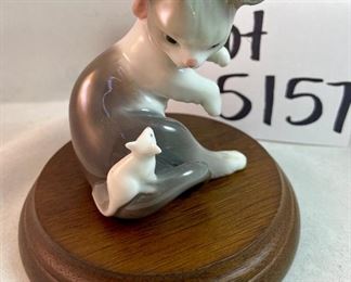 Lot 5157.  $115.00. A lovely Lladro lot includes a 1985- Lladro Collectors Society Don Quixote Plaque (6"wx4"h) with a shell design on the back. 1984 Lladro Cat 'n Mouse (2.5"hx3"w) figurine, and a Porcelain "Nosegay" 4.5" x 2"h. Little wooden stand not included. 