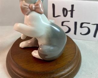 Lot 5157.  $115.00. A lovely Lladro lot includes a 1985- Lladro Collectors Society Don Quixote Plaque (6"wx4"h) with a shell design on the back. 1984 Lladro Cat 'n Mouse (2.5"hx3"w) figurine, and a Porcelain "Nosegay" 4.5" x 2"h. Little wooden stand not included. 