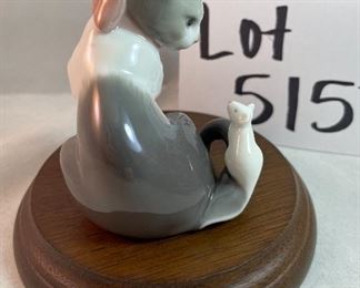 Lot 5157.  $115.00. A lovely Lladro lot includes a 1985- Lladro Collectors Society Don Quixote Plaque (6"wx4"h) with a shell design on the back. 1984 Lladro Cat 'n Mouse (2.5"hx3"w) figurine, and a Porcelain "Nosegay" 4.5" x 2"h. Little wooden stand not included. 