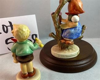 Lot 5158. $56.00. Interesting Lot of 5 Hummel and Goebel Figures. Hummel "Chick Girl" 3.5"h x 3"w. Hummel "Apple Tree Girl" 3.5"h x 2.5"w. Hummel Boy with Hen 3"h x 2"w. Goebel Bluebird, and Vintage Goebel Bunny Painting Egg 4-827 (1979-1991) 3.5"h x 3"w. Wooden stand not included. 