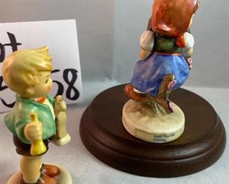 Lot 5158. $56.00. Interesting Lot of 5 Hummel and Goebel Figures. Hummel "Chick Girl" 3.5"h x 3"w. Hummel "Apple Tree Girl" 3.5"h x 2.5"w. Hummel Boy with Hen 3"h x 2"w. Goebel Bluebird, and Vintage Goebel Bunny Painting Egg 4-827 (1979-1991) 3.5"h x 3"w. Wooden stand not included. 