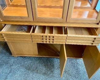 Lot 5200. $795.00  MCM/Arts and Craft Style Lit Buffet/Display cabinet. Maple w/2 glass shelves, 3 drawers and 3 Door Cabinet. Made in Canada. 82" H x 58" W x 19"D.
