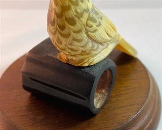 Lot 5161.  $27.00. "You cannot roller skate in a buffalo herd..." but you can own a carved buffalo horn bird on a branch! We will include this pewter Buffalo incased in glass and a metal western cup. 